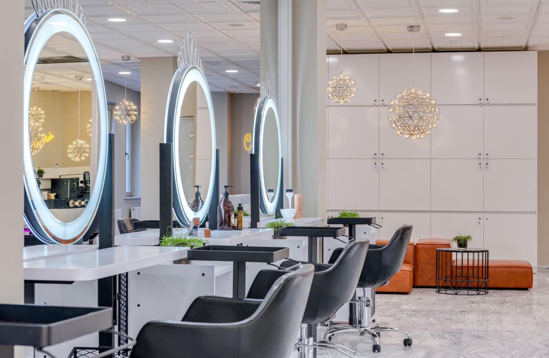 Bright hair salon interior with styling chairs