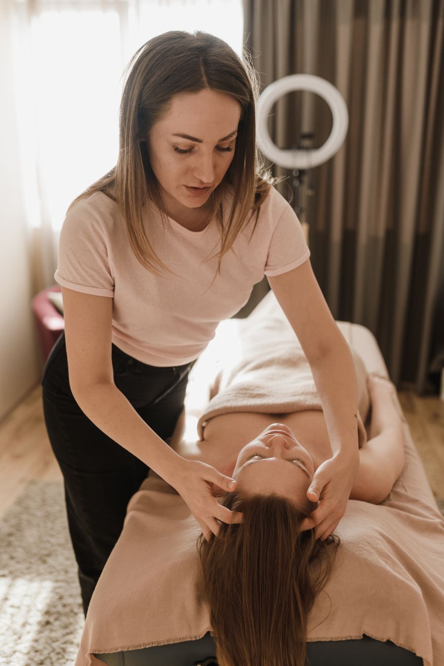 Woman receiving a head massage